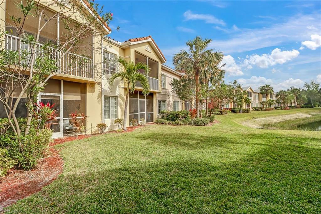 20301 Estero Gardens Circle, Unit 104 Estero, FL 33928 - Photo 25 of 43 a view of a house with a garden
