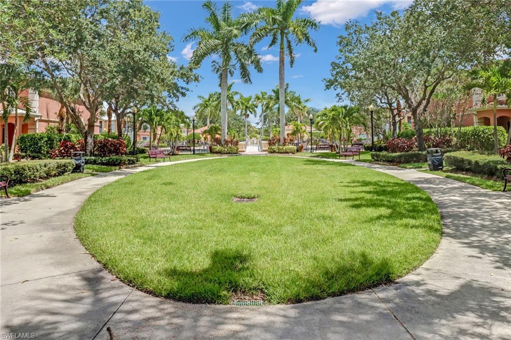 20301 Estero Gardens Circle, Unit 104 Estero, FL 33928 - Photo 33 of 43 a view of a backyard with palm trees