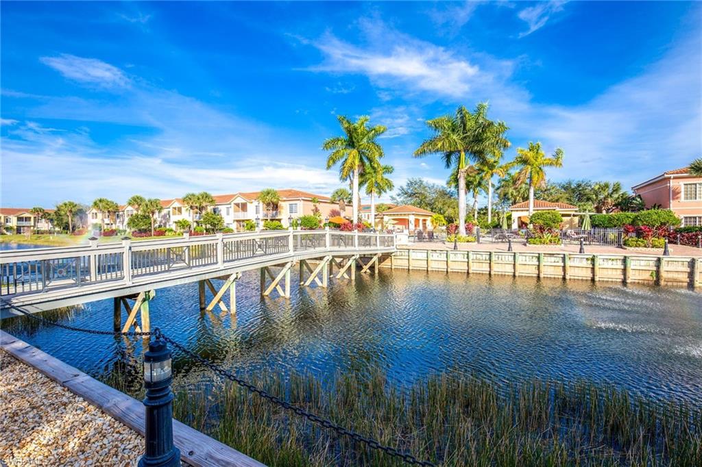 20301 Estero Gardens Circle, Unit 104 Estero, FL 33928 - Photo 41 of 43 a view of a lake with a ocean view