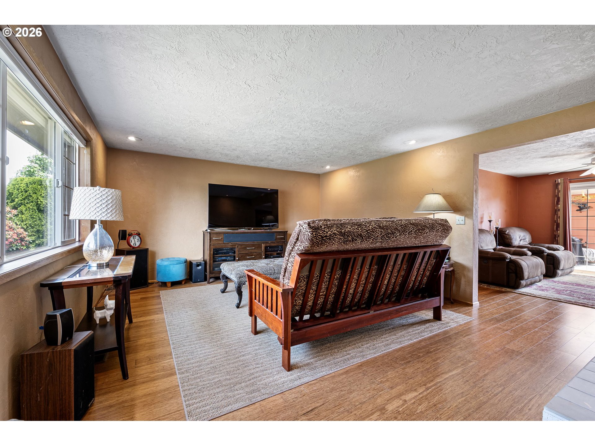 2465 17th Street Springfield, OR 97477 - Photo 6 of 47 a living room with furniture a flat screen tv and a large window