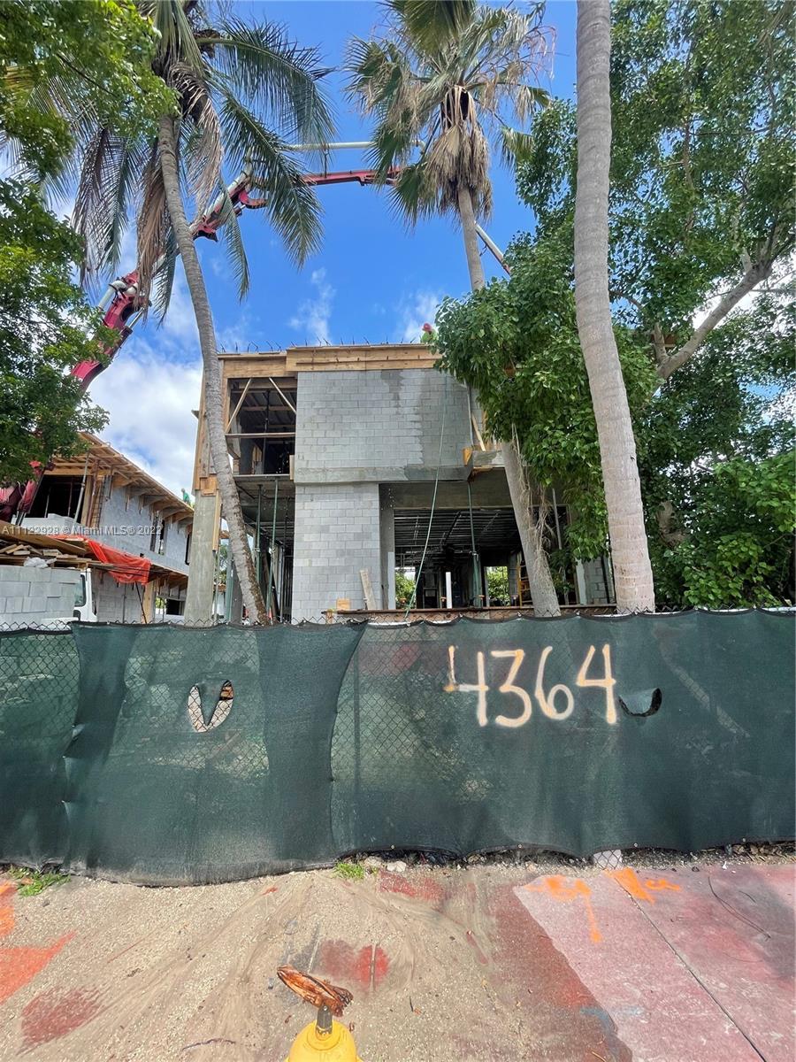 4364 Alton Road Miami Beach, FL 33140 - Photo 12 of 14 a front view of a house with a yard