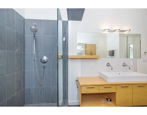 8 Bird Hill Road Lexington, MA 02421 - Photo 20 of 30 a bathroom with a sink and a mirror