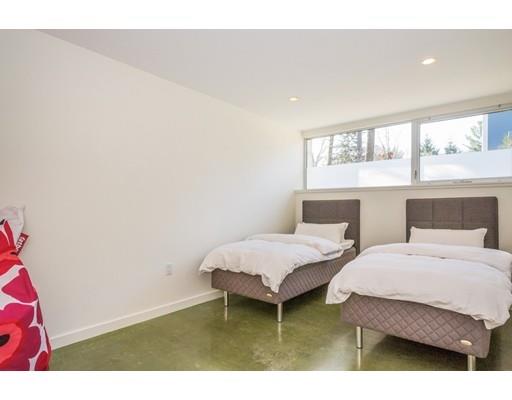 8 Bird Hill Road Lexington, MA 02421 - Photo 23 of 30 a bedroom with two beds and a large window