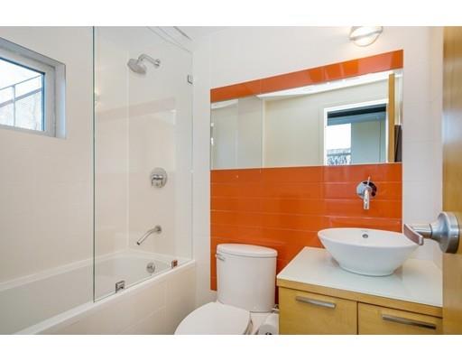 8 Bird Hill Road Lexington, MA 02421 - Photo 24 of 30 a bathroom with a sink a toilet and shower