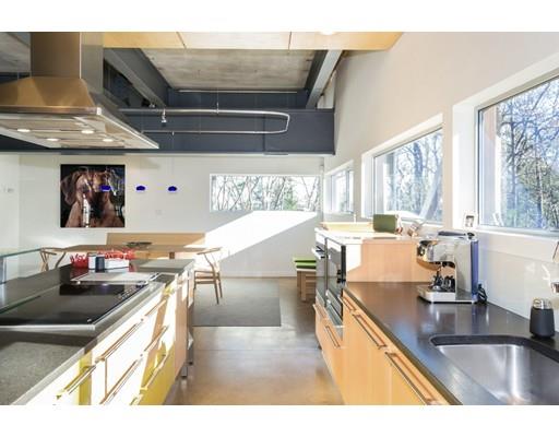 8 Bird Hill Road Lexington, MA 02421 - Photo 4 of 30 a kitchen with stainless steel appliances granite countertop a sink stove and cabinets