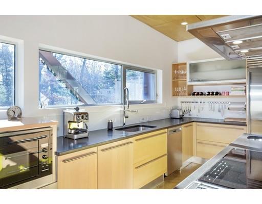8 Bird Hill Road Lexington, MA 02421 - Photo 5 of 30 a kitchen with a sink and wooden cabinets