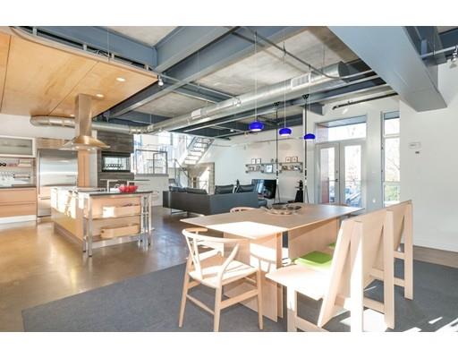8 Bird Hill Road Lexington, MA 02421 - Photo 9 of 30 a dining room with stainless steel appliances kitchen island granite countertop a table and chairs
