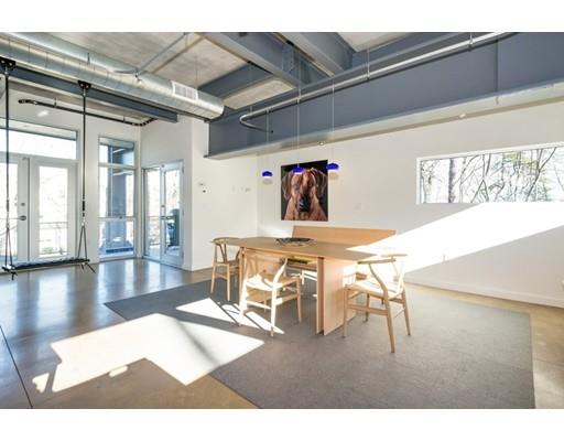 8 Bird Hill Road Lexington, MA 02421 - Photo 10 of 30 a dining room with furniture and a chandelier