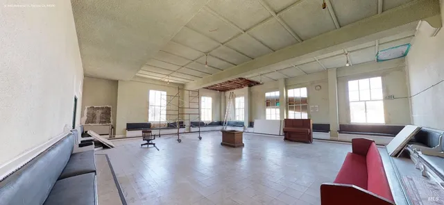 a living room with furniture or couch and a large window