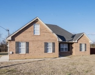 3039 Ridgewood Drive Christiana, TN 37037 - Photo 1 of 20 a front view of a house with a yard