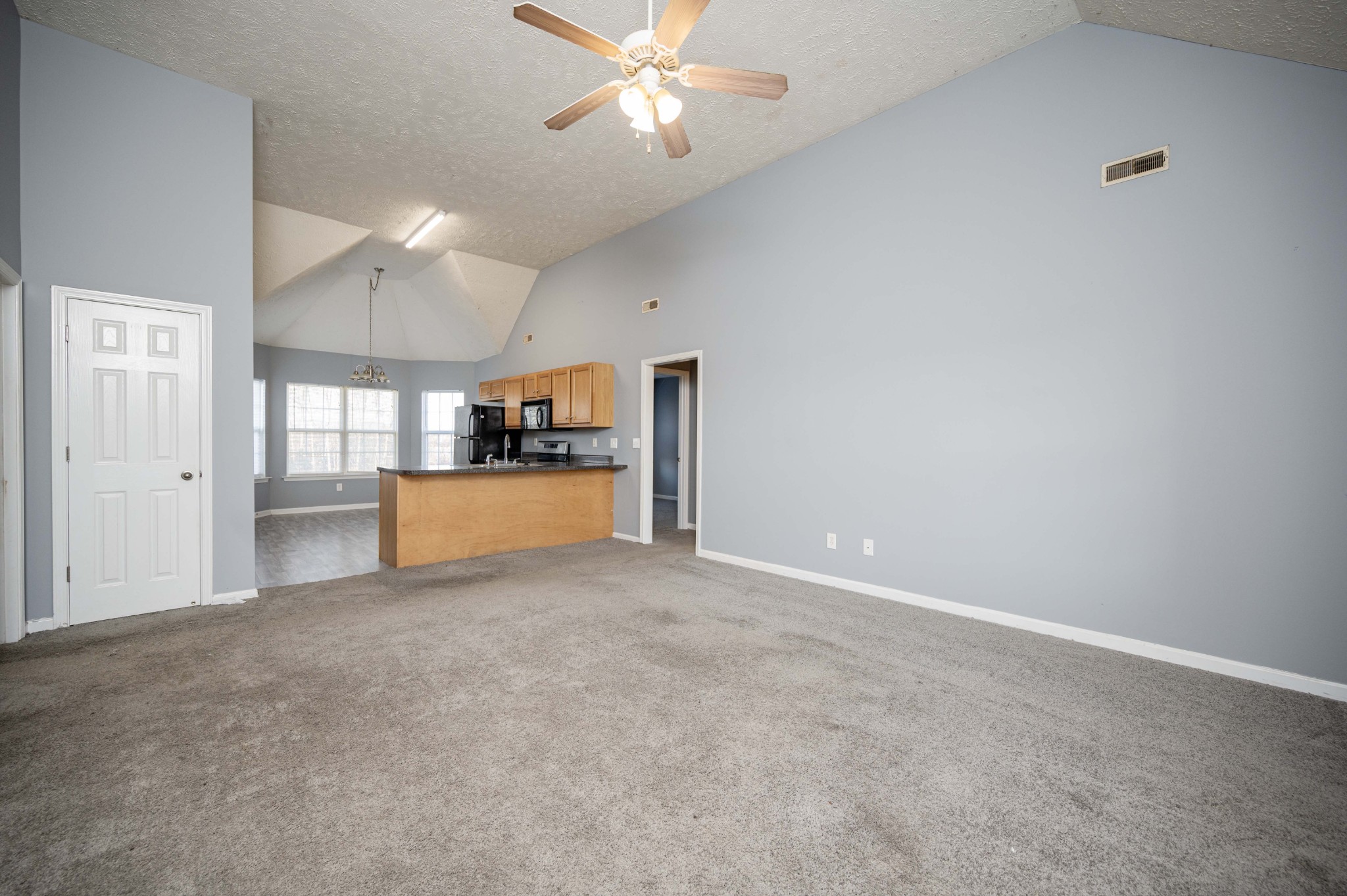 3039 Ridgewood Drive Christiana, TN 37037 - Photo 5 of 20 a view of a kitchen with a sink and a cabinet a ceiling fan and kitchen view