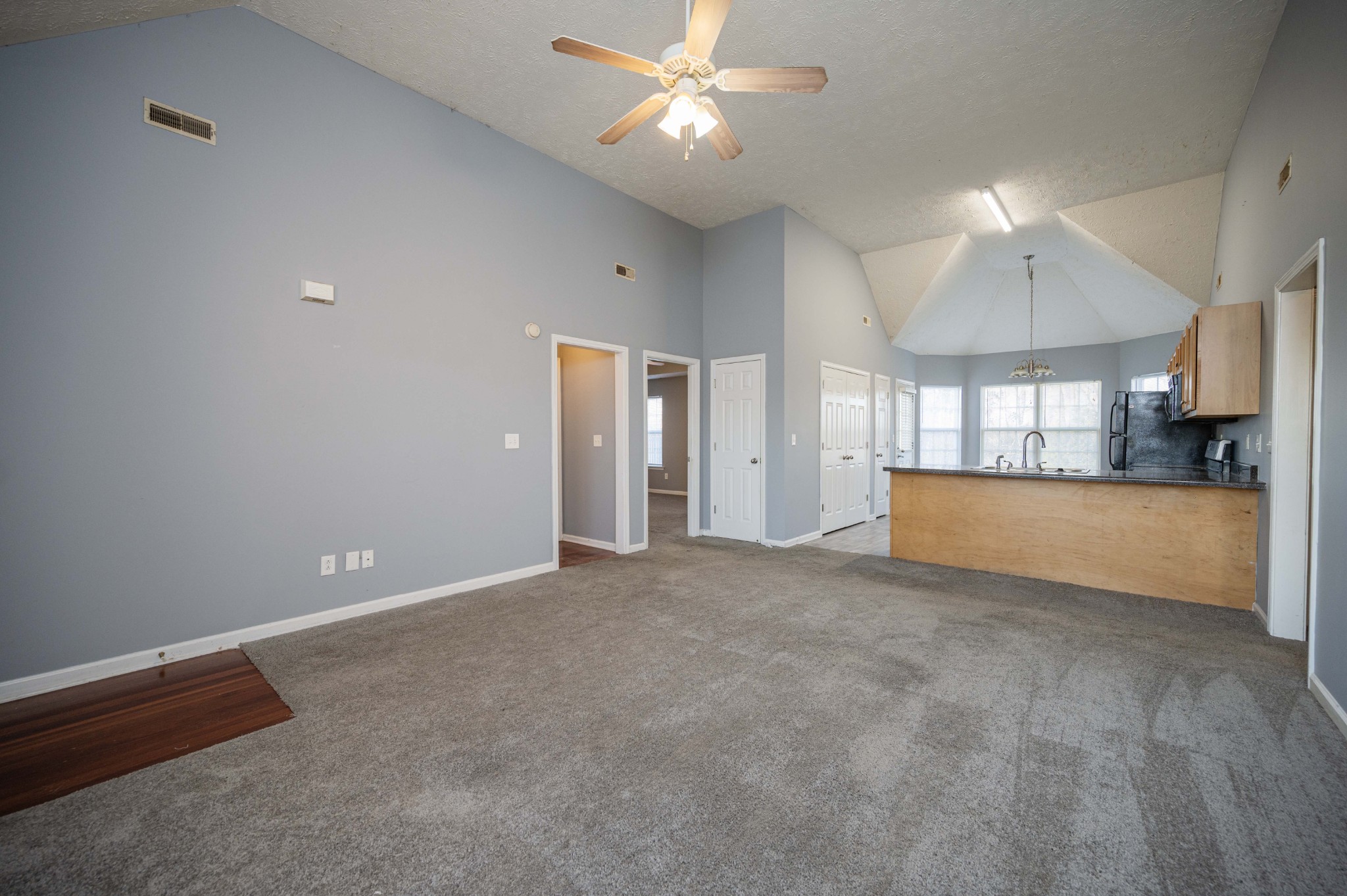 3039 Ridgewood Drive Christiana, TN 37037 - Photo 7 of 20 a view of a kitchen with a sink and a chandelier fan