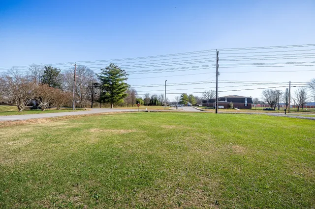 a view of building with yard