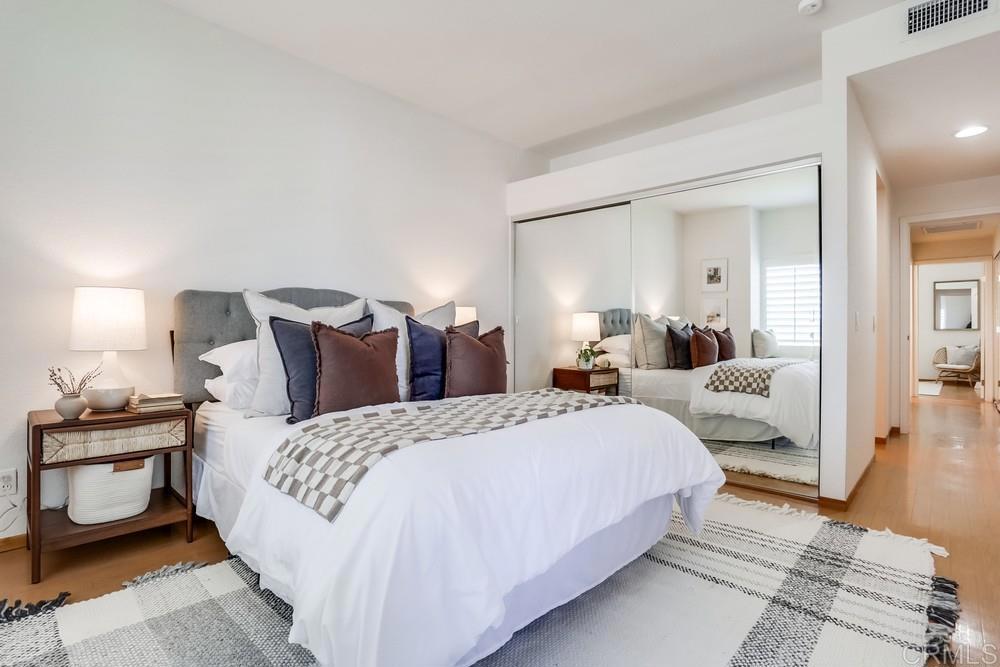 1520 Via Risa San Marcos, CA 92078 - Photo 20 of 34 a bedroom with bed and a night stand