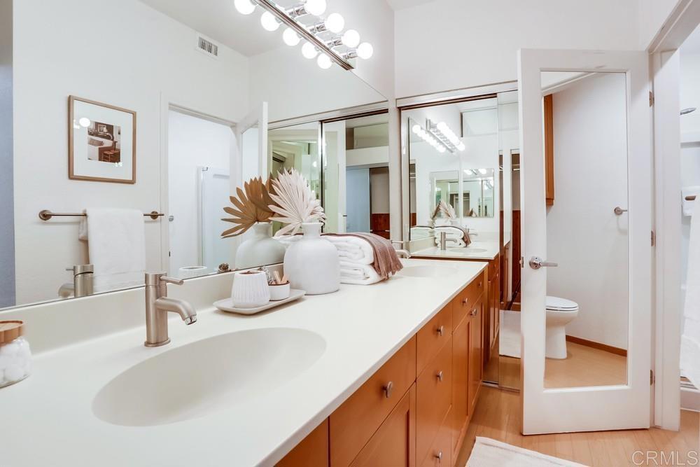 1520 Via Risa San Marcos, CA 92078 - Photo 22 of 34 a bathroom with a double vanity sink and a mirror