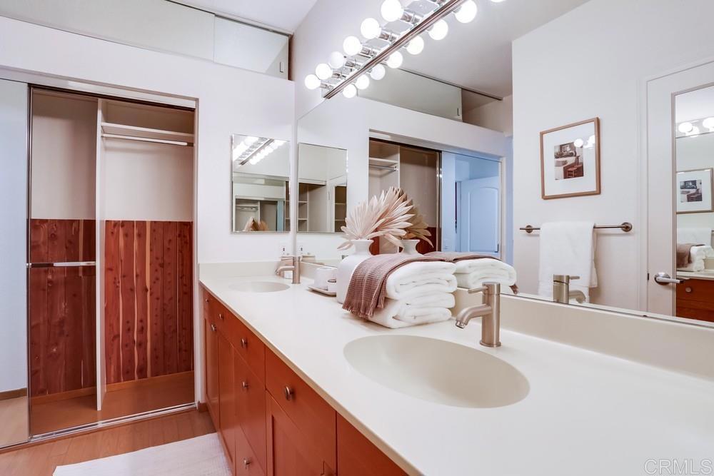 1520 Via Risa San Marcos, CA 92078 - Photo 23 of 34 a en suite bathroom with a double vanity sink and a mirror
