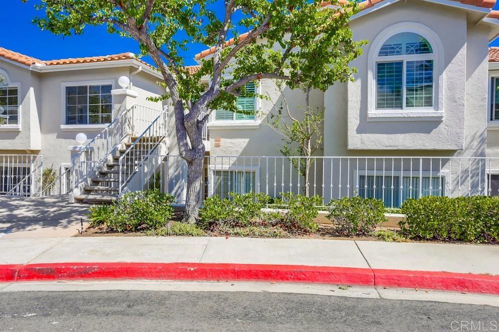 1520 Via Risa San Marcos, CA 92078 - Photo 3 of 34 a view of a house with a yard and potted plants