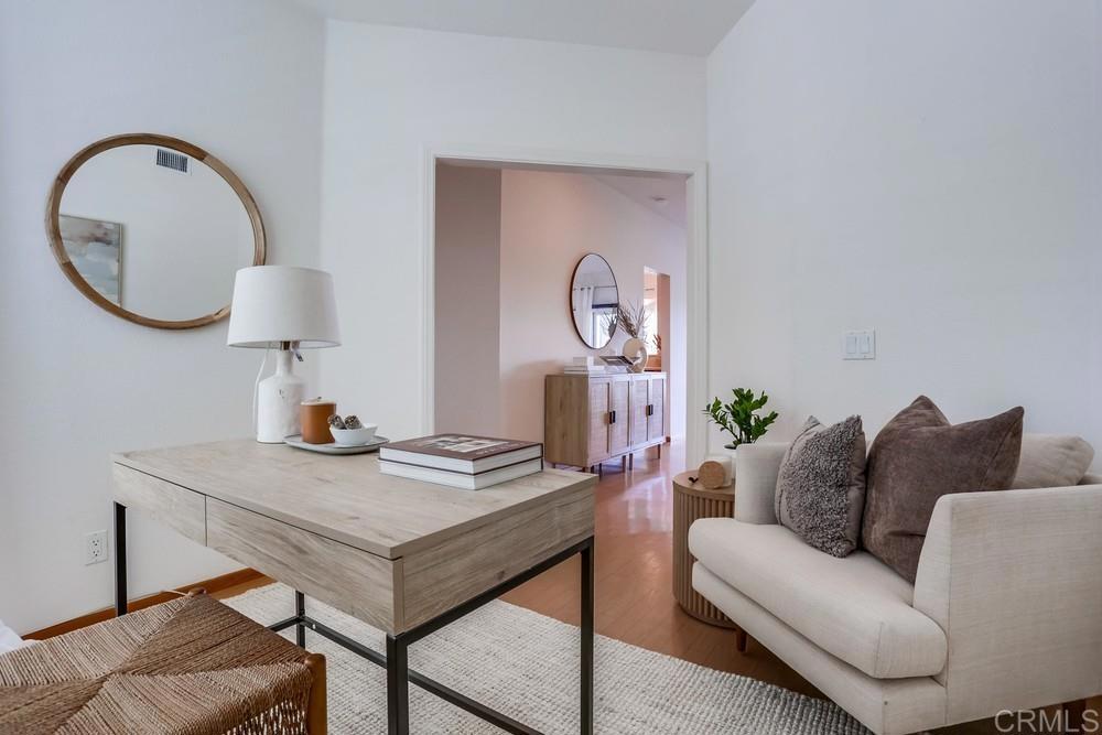 1520 Via Risa San Marcos, CA 92078 - Photo 6 of 34 a living room with furniture and a mirror
