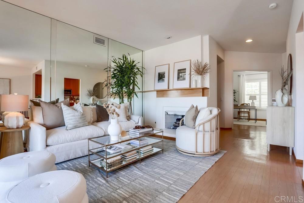 1520 Via Risa San Marcos, CA 92078 - Photo 9 of 34 a living room with furniture a table and wooden floor