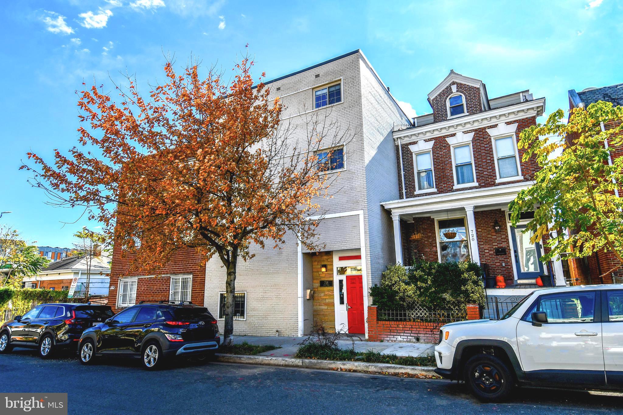 718 Park Road Northwest, Unit 4 Washington, DC 20010 - Photo 5 of 18 a view of a cars park in front of a building