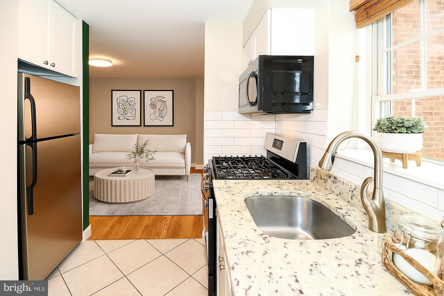 718 Park Road Northwest, Unit 4 Washington, DC 20010 - Photo 7 of 18 a kitchen with a refrigerator sink and a stove top oven