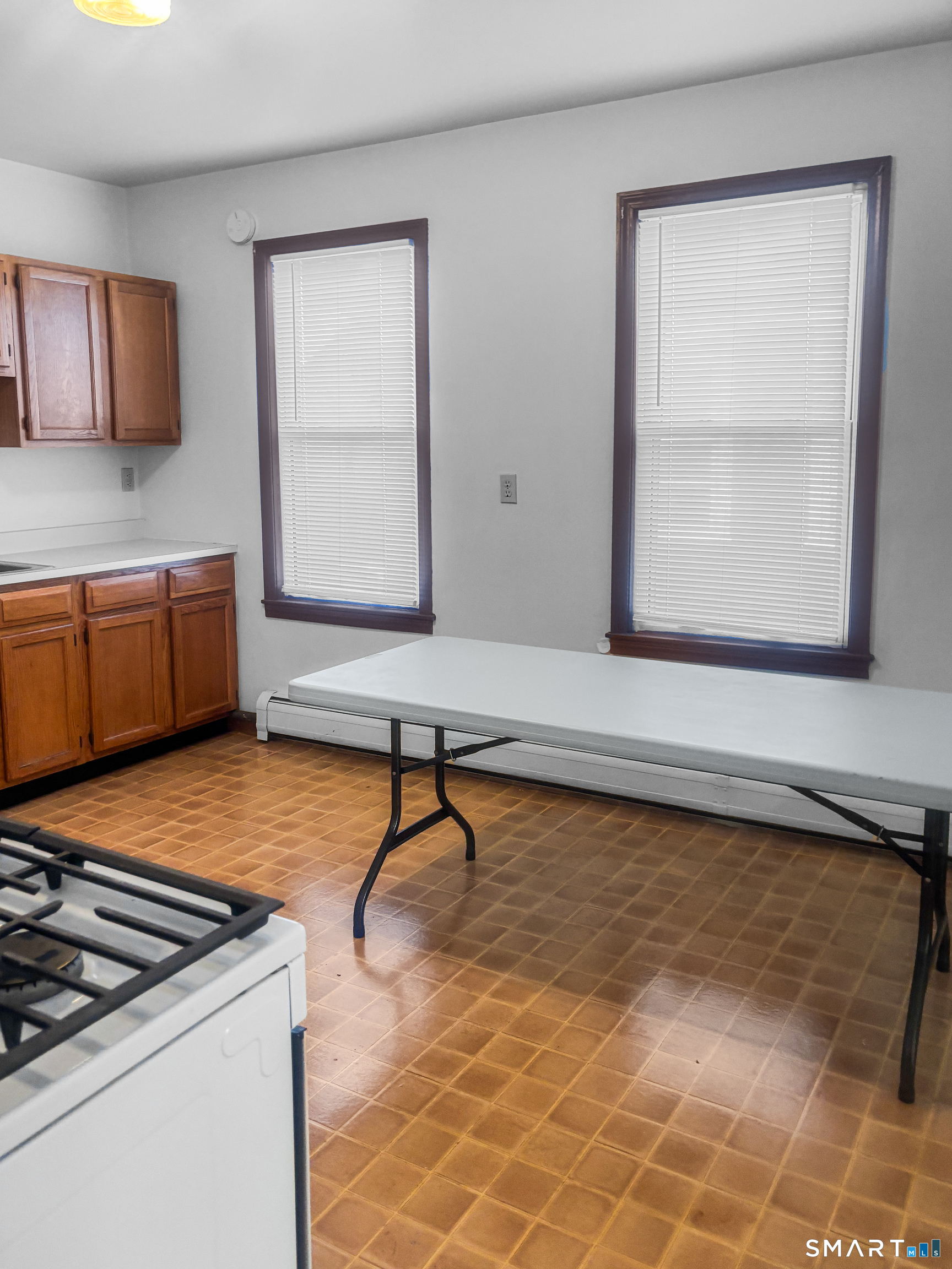 a room with pool table and window