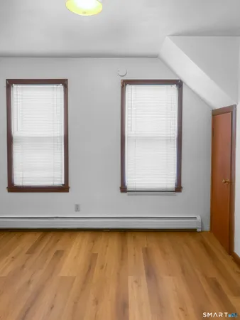 a view of wooden floor and a window