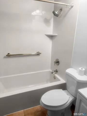 a bathroom with a sink a toilet and a bathtub