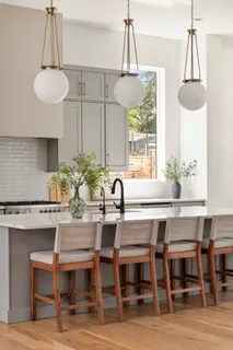 a dining room table chair and a potted plant