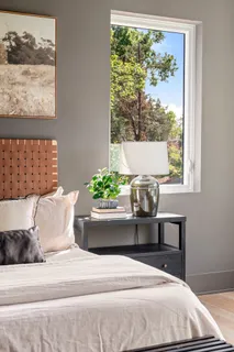 a room with walk in closet and wooden floor