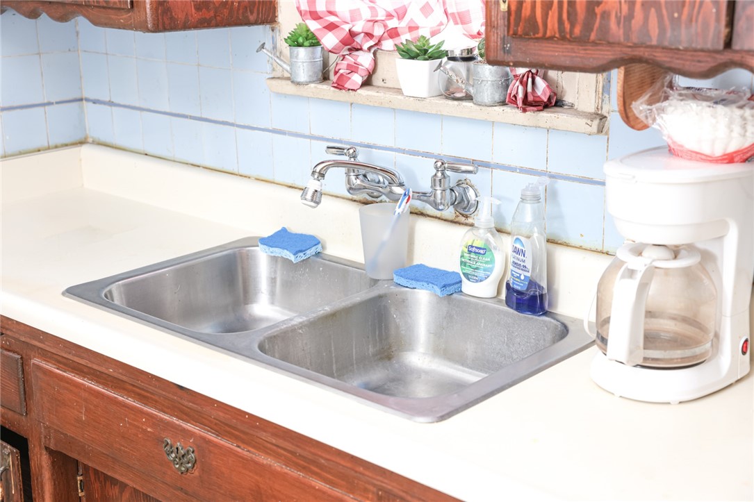 309 West Reeve Street Compton, CA 90220 - Photo 16 of 37 a kitchen with a sink and a mirror