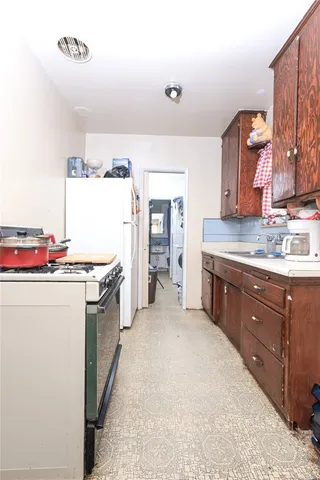 a bedroom with a bed and cabinets