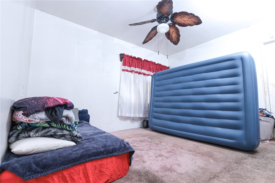 309 West Reeve Street Compton, CA 90220 - Photo 18 of 37 a bedroom with a bed and cabinets