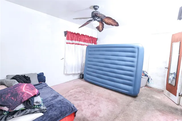 a bathroom with a sink toilet and mirror