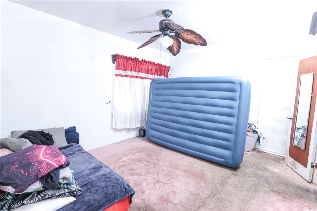309 West Reeve Street Compton, CA 90220 - Photo 19 of 37 a view of room with a bed and couch