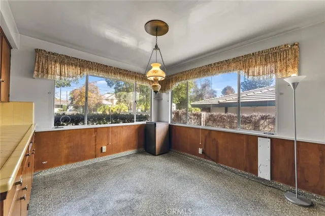 a kitchen with a stove sink and cabinets