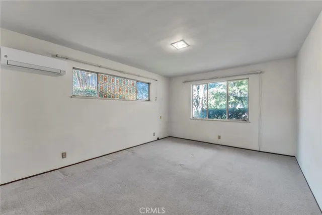 an aerial view of multiple houses with yard