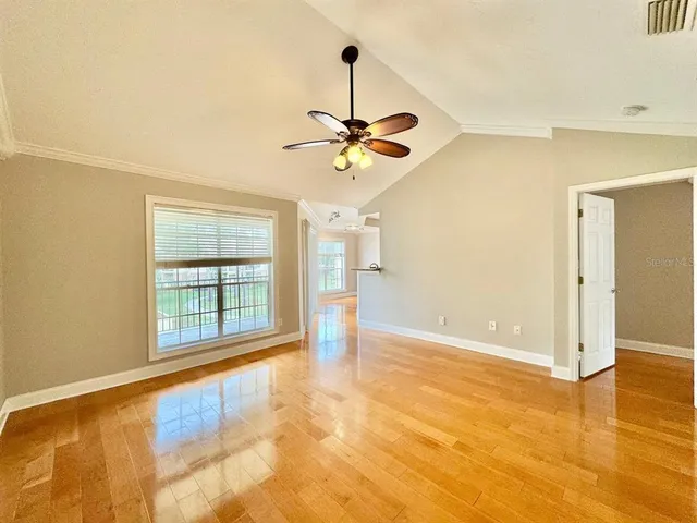 a view of an empty room with a window