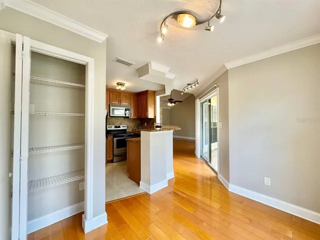 a kitchen with a refrigerator and a sink