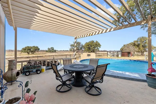 a view of a terrace with furniture and stove