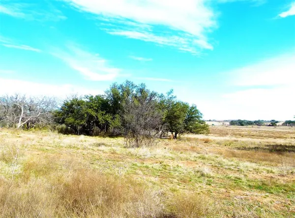 a view of lake with green space