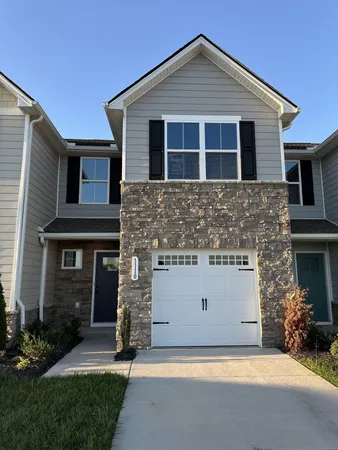 a view of a house with brick wall and a large window