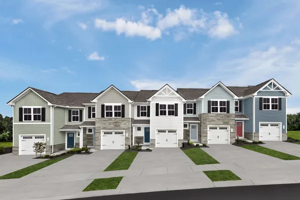 a front view of a house with yard