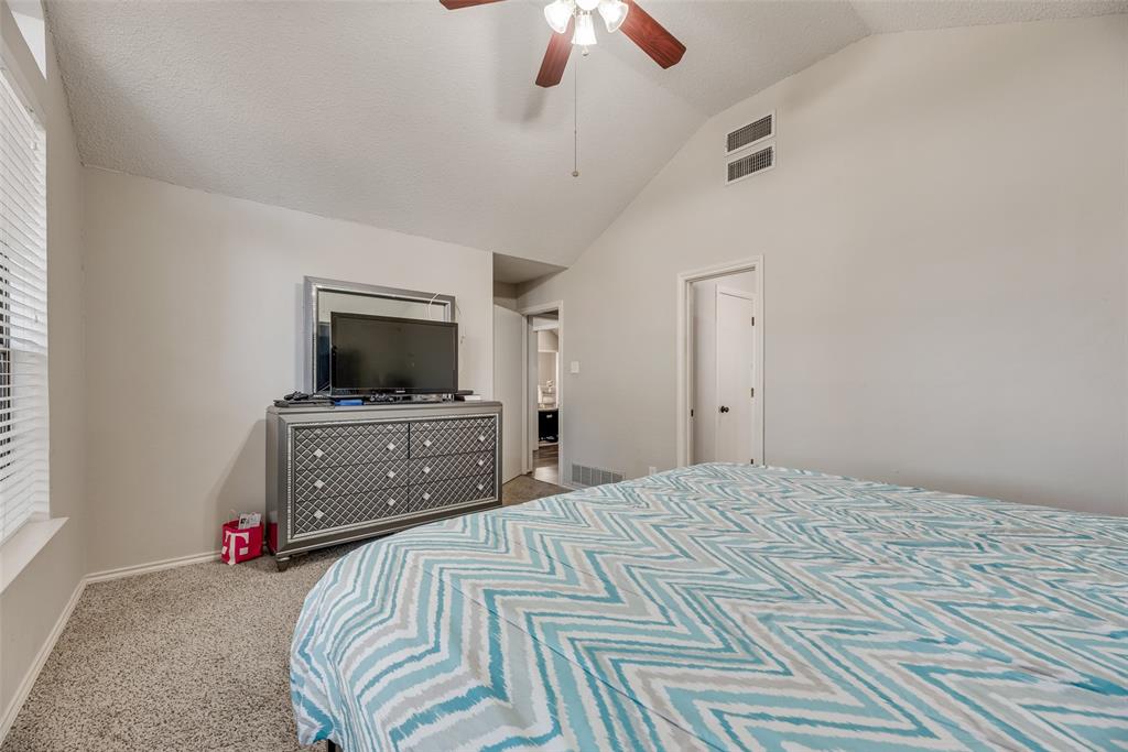 4102 Autumn Ridge Court Arlington, TX 76016 - Photo 14 of 20 Bedroom featuring carpet flooring, high vaulted ceiling, ceiling fan, and a textured ceiling