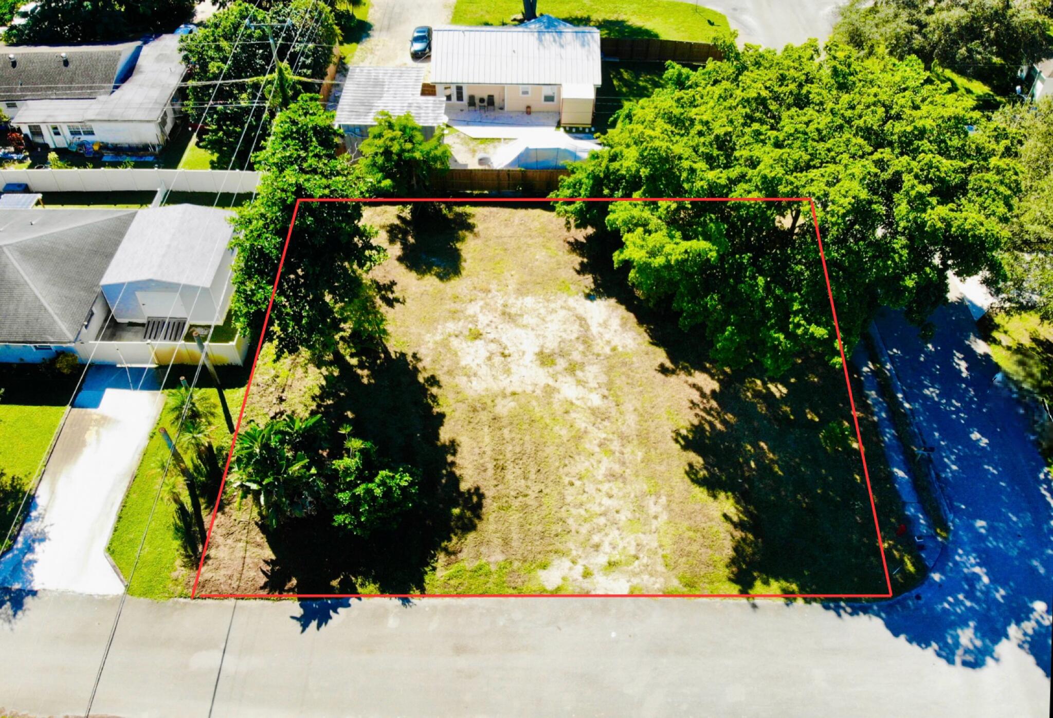 4802 Bonanza Road Lake Worth, FL 33467 - Photo 2 of 10 an aerial view of residential houses with yard