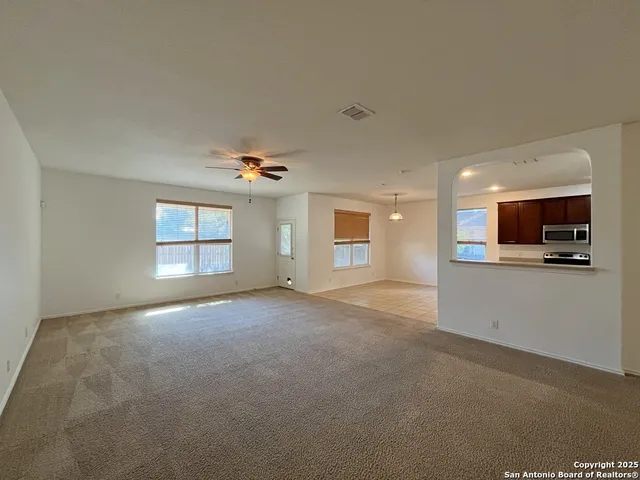 a view of an empty room and window