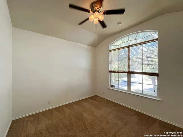 a bathroom with a sink mirror and toilet