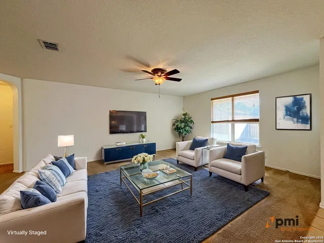 a living room with furniture and a window