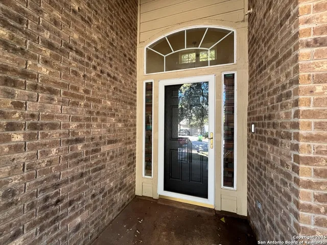 a view of a golf course with a wooden fence
