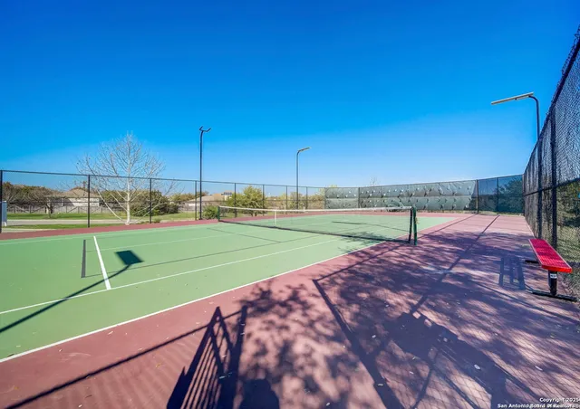 a view of a house with pool and garden